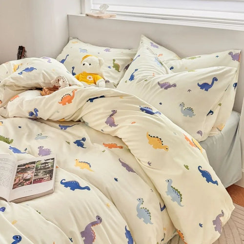 ensemble literie dinosaures colorés motifs enfantins taies oreillers couvre lit tricot gris moderne enfants