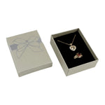 boîte rangement bijoux or rouge argent noir brillants rubis classique élégant pendentifs fermeture éclair
