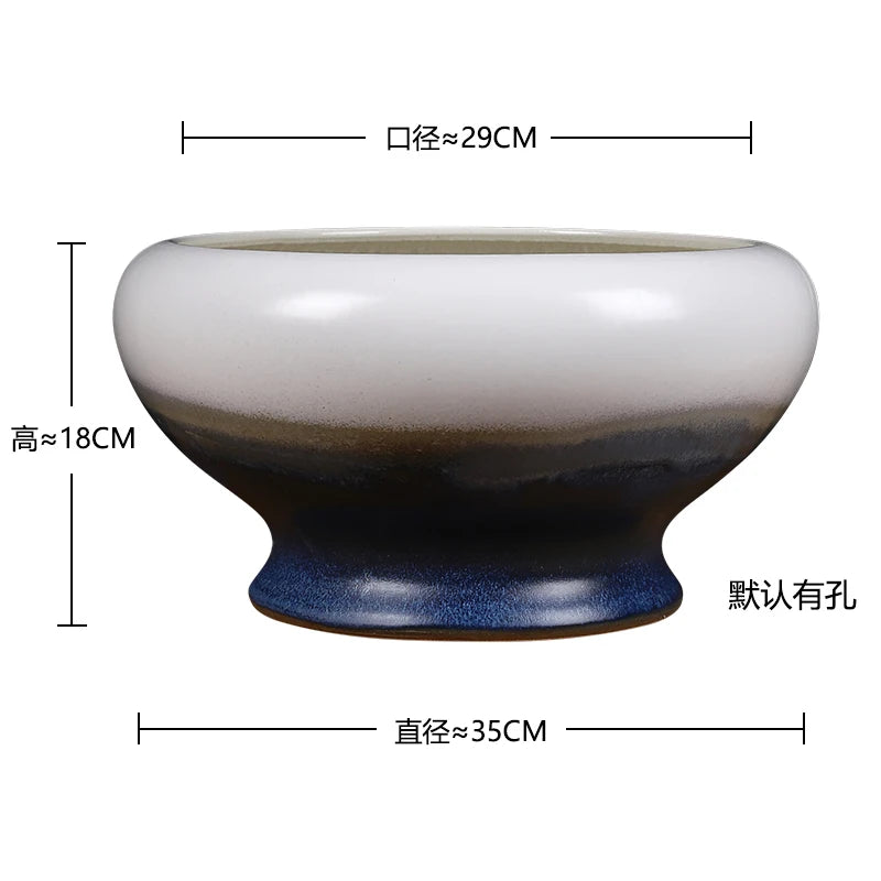 Bol de céramique de design moderne aux couleurs contrastées, avec des nuances de blanc, de marron et de bleu, d'un diamètre d'environ 35 cm et d'une hauteur de 18 cm.