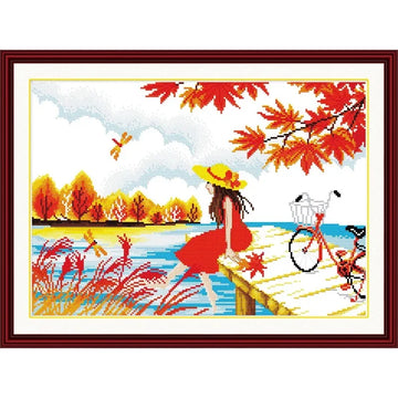 broderie point croix attente automne feuilles femme robe rouge vélo paysage champêtre instructions fils
