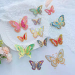 papillons décoratifs transparents effet holographique adhésifs 3d élégants rose vert bleu doré pack 12