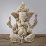 statue ganesha résine sculptée décorative religieuse éléphant fleurs blanches maison