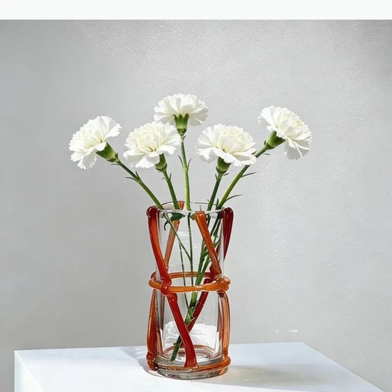 vase moderne transparent tiges entrelacées orange sans fleur