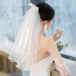 voile mariée tulle plissé blanc classique romantique fixé noeud transparent élégant
