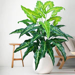 plante artificielle moderne arbre monstera feuilles vertes decoration intérieure pot blanc contemporain exposition maison