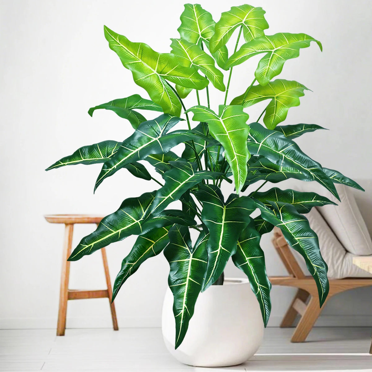 plante artificielle moderne arbre monstera feuilles vertes decoration intérieure pot blanc contemporain exposition maison