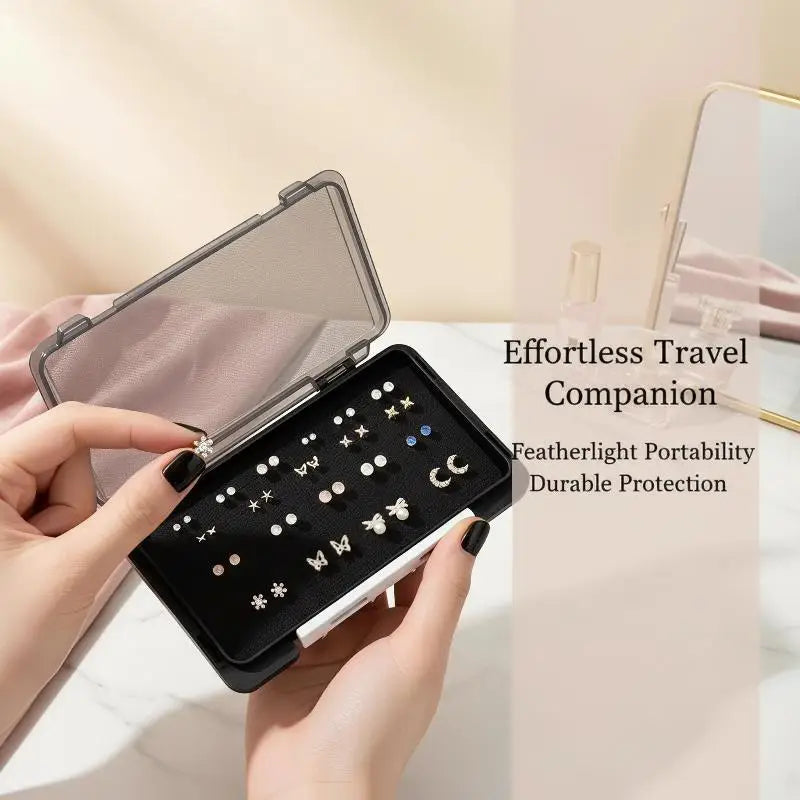 boîte rangement boucles oreilles noire grise texture fine pratique clips bijoux organiser