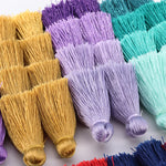 pompons franges polyester décoratifs modernes couleur bleu noir beige rose violet vert jaune blanc
