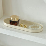 plateau ovale moderne noir mat bijoux parfum flacon lotion bougie calendrier decoration