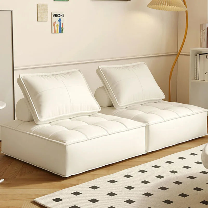 canapé lit moderne cuir noir blanc marron oreillers minimaliste salon