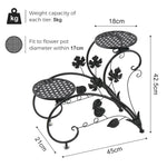 meuble plante métal noir niveaux feuilles stylisées art nouveau pots blancs arrosoir bleu balcon