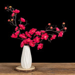 bouquet artificiel fleurs jaune rouge rose blanc branches noires vase blanc décoration intérieureextérieur