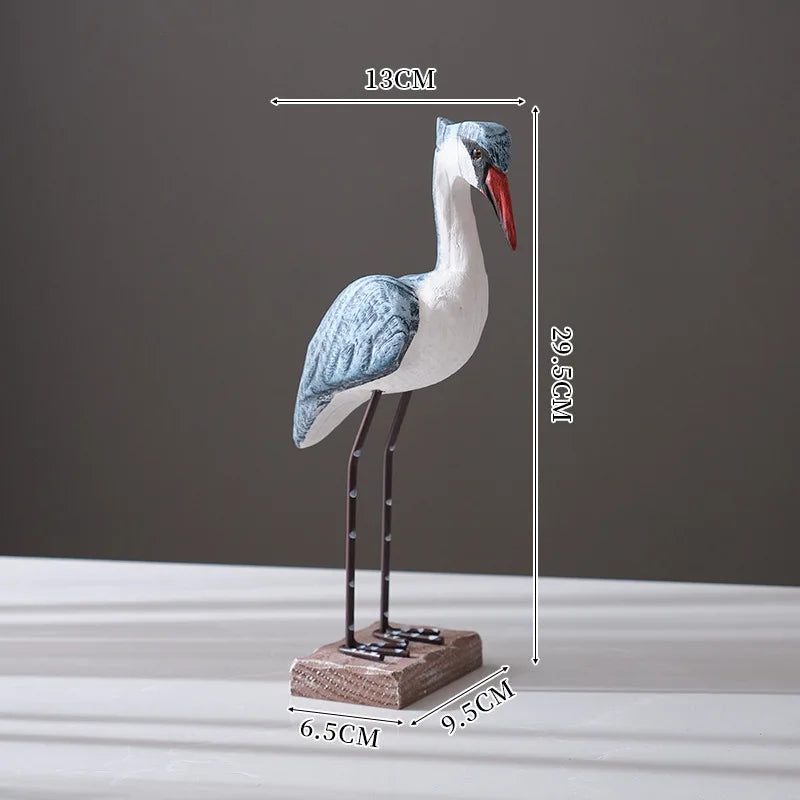 statue oiseau blanc gris bleu rouge texture plumes détails métalliques base bois moderne artisanal