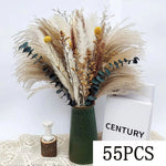 bouquets pampas marron clair beige blanc feuilles vertes plumes blanches décoration intérieure mariage boho