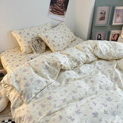 ensemble literie motifs floraux blanc cassé violet vert doux minimaliste chambre coucher