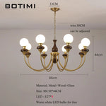 lustres modernes chandelier or marron foncé ampoules led globes opaques éléments décoratifs