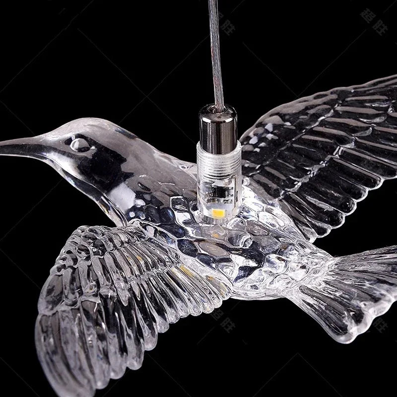 suspension lumineuse oiseaux transparente moderne contemporain lumière blanche salle manger chambre salon