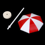 parasols miniatures décorations paysage moderne rouge blanc bleu jaune rayures horizontales tringle base circulaire