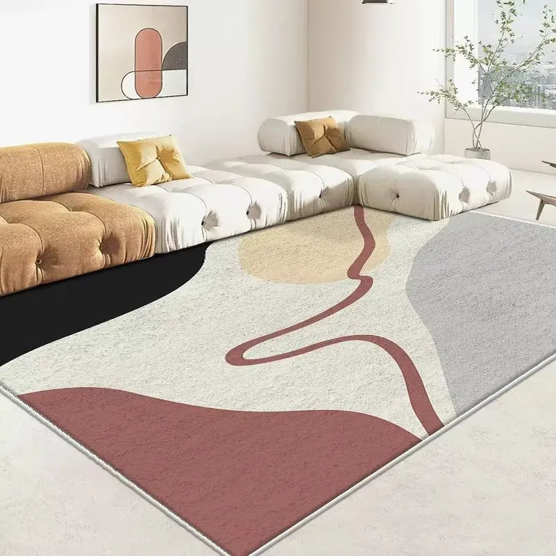 Le tapis crème et gris de cette pièce spacieuse et aérée complète parfaitement le mobilier moderne et épuré, créant ainsi une atmosphère chaleureuse et accueillante.