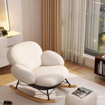fauteuil bascule moderne beige noir orange roulettes coussin repos minimaliste salon