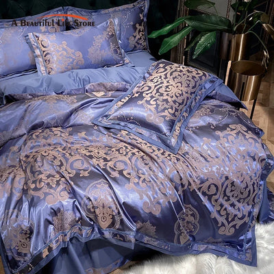 Parure de lit coton jacquard satin doux bleu or gris sur un lit Queen