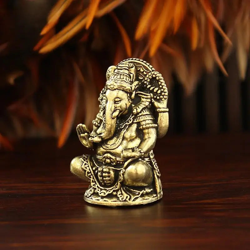statues ganesha bronze doré détails sculptés traditionnelles indiennes ornement maison