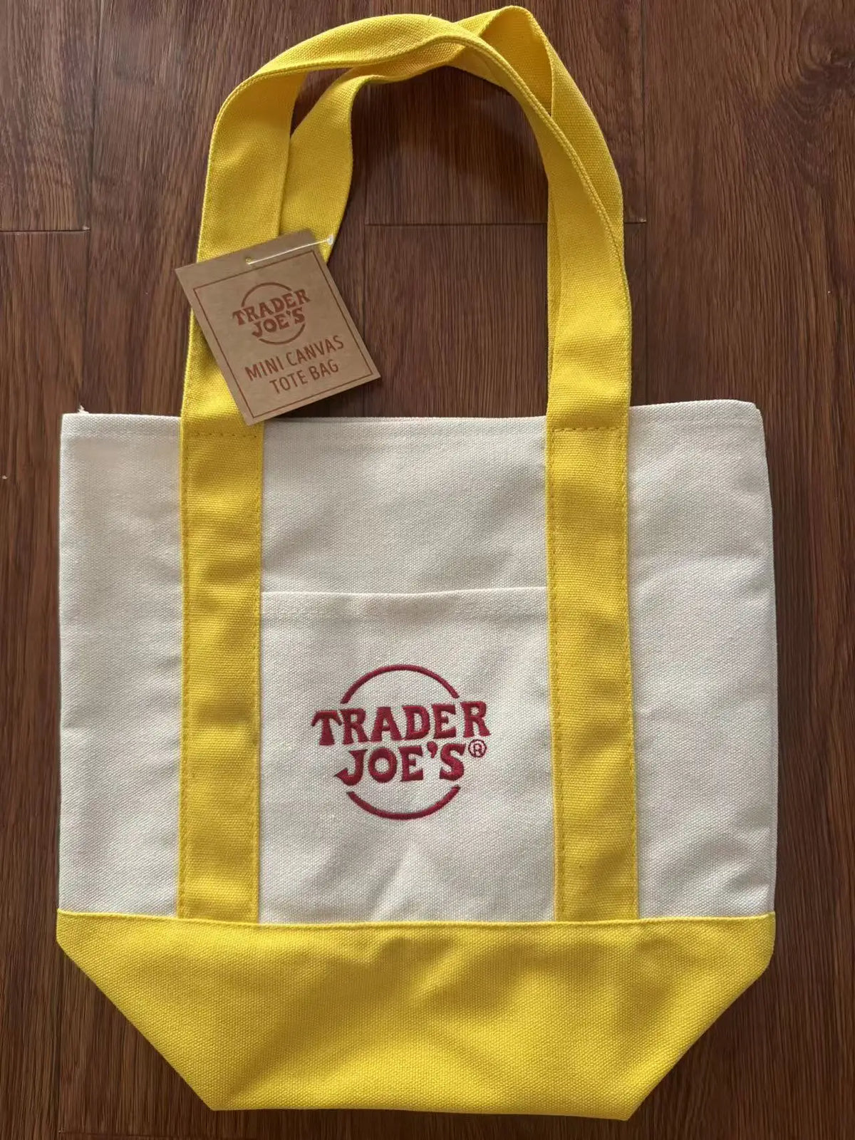 sac main toile verte rouge blanc jaune trader joes logo poignées simple pratique