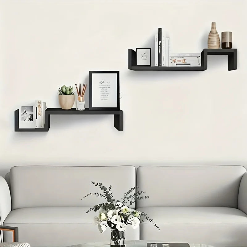 étagère murale moderne noire blanche rangement boîtes cadre photo vase horloge livre plante