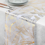 nappe moderne élégante feuilles dorées blanc décoration table serviettes assiettes verres