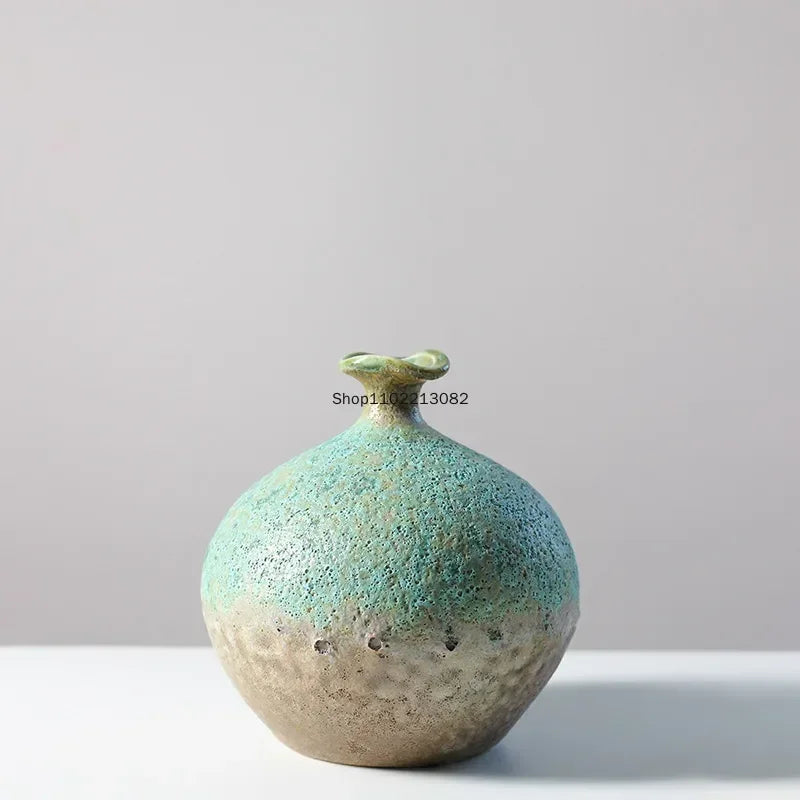 vase céramique rustique vert beige marron texturé variations couleur branches feuilles arrangement floral
