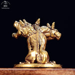 statue cerbère trois têtes doré bronze détails sculptés base texturée maison artisanat mythologie