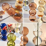 vases transparents modernes sphères empilées bleu vert marron beige