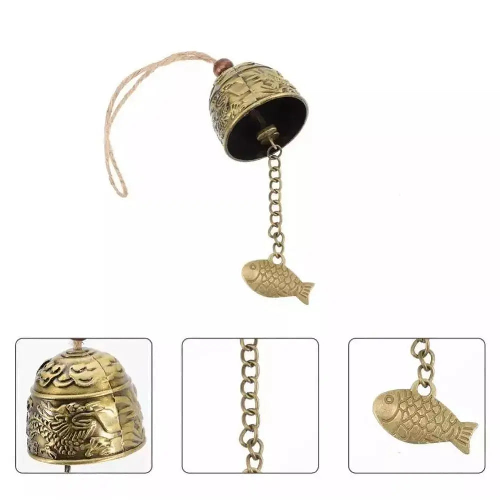cloche décorative artisanale bronze doré ornements floraux poissons vintage pendentif métallique