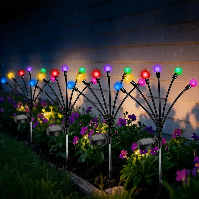 éclairage paysager solaire led moderne boules lumineuses colorées branches métalliques fixation tige terreextérieur nocturne