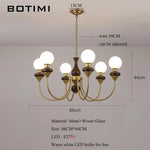 lustres modernes chandelier or marron foncé ampoules led globes opaques éléments décoratifs