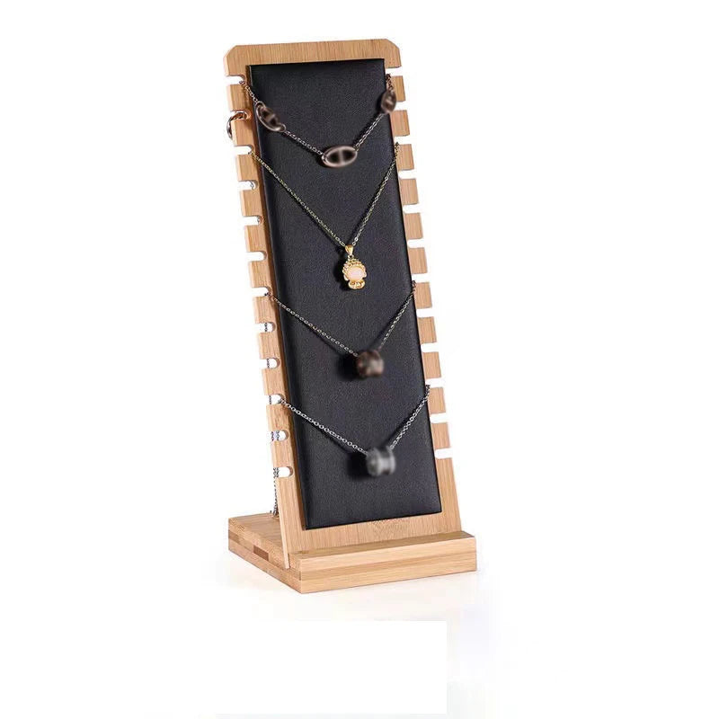 présentoir bois colliers pendentifs chaînes organisation bijoux moderne différents motifs argenté doré