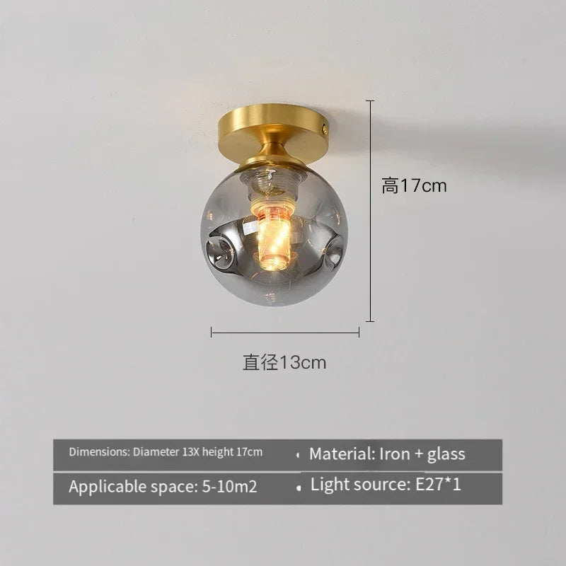 lampe moderne verre transparent noir doré élégante sphérique éclairage contemporain
