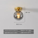 lampe moderne verre transparent noir doré élégante sphérique éclairage contemporain