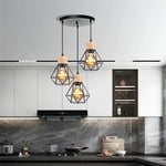 suspension lumineuse industrielle cage métal finition bois naturel ampoule filament noir moderne