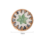 tapis tasse bohème motifs floraux assiettes décoratives cercles colorés bord marron tresse artisanal table