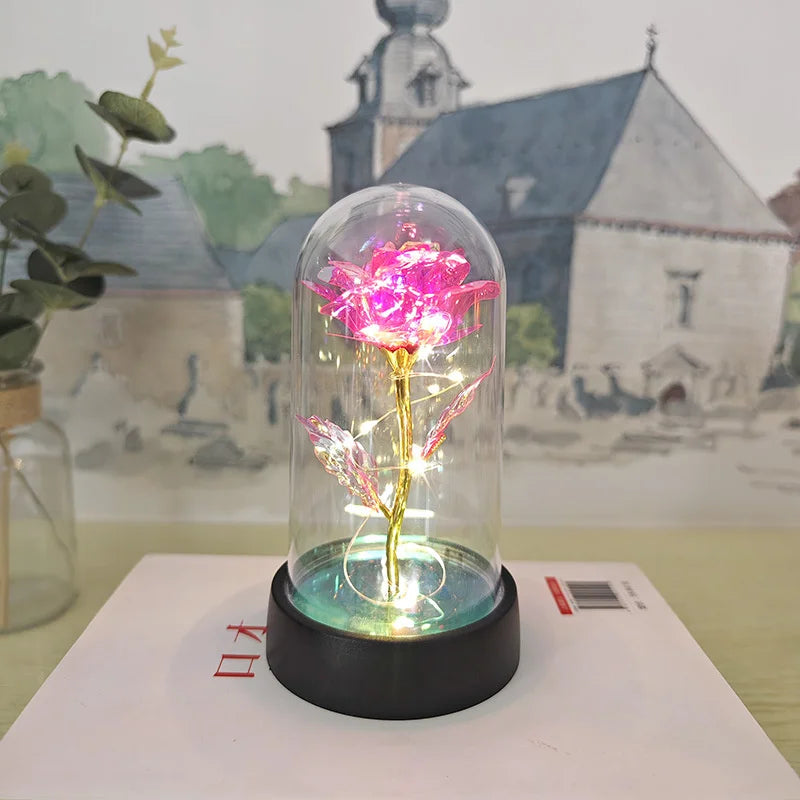 lampe led rose stabilisée dorée feuilles vertes moderne nuit multicolore base noire verre transparent