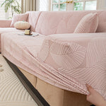 housse canapé extensible beige clair motif feuilles imprimées moderne protection meubles