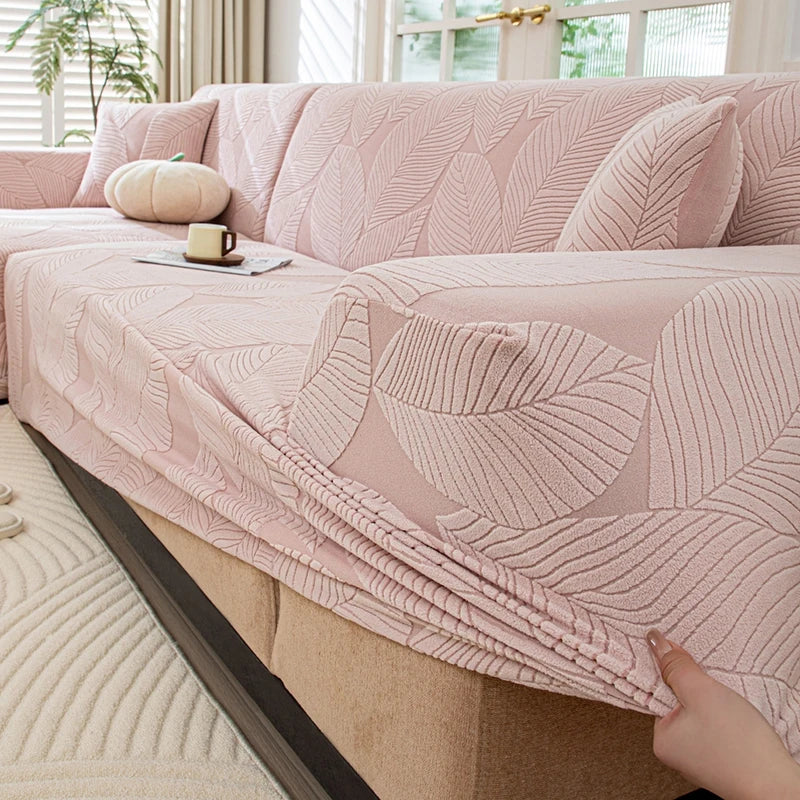 housse canapé extensible beige clair motif feuilles imprimées moderne protection meubles
