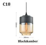 suspension lumineuse moderne pendentif verre noir transparent contemporain fixation câble luminaire salle manger chambre