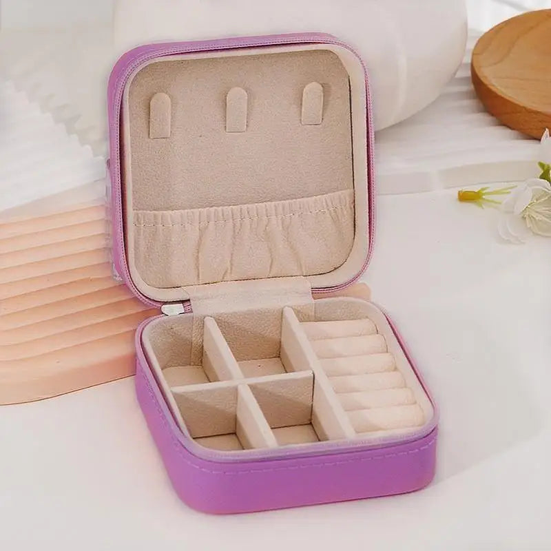 boîte bijoux simili cuir zippée compartiments moderne vert rose beige noir