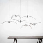 suspension lumineuse moderne oiseau stylisé blanc noir éclairage salon chambre led résine intérieur