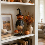 figurine halloween citrouille orange visage chapeau robe bas suspendue noire