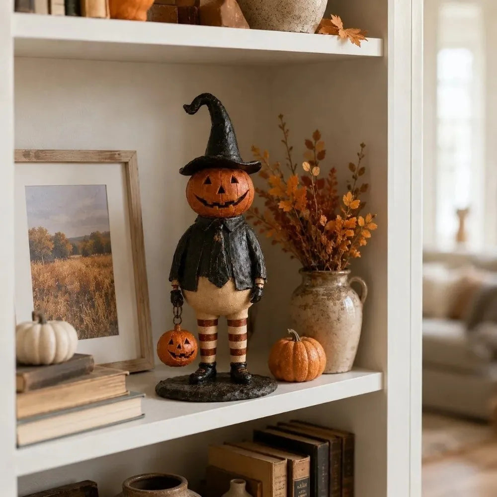 figurine halloween citrouille orange visage chapeau robe bas suspendue noire