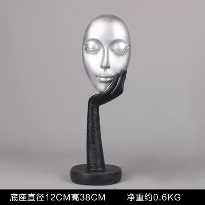masque sculptural contemporain noir blanc doré finement sculpté base circulaire ornement salon