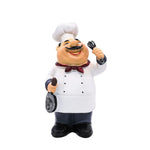 figurine cuisinier cartoon blanc gris rouge texture résinée brillante assiettes fruits spatule cuillère